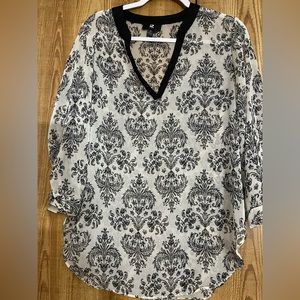 Medium long sleeve black and white unique printed blouse